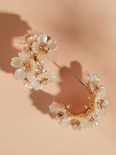 From casual chic to bohemian flair, these flower cluster open hoops bloom with versatility. Playful petals add a touch of personality to any outfit, letting your style blossom Beauty Bible, Wedding Branding, Flower Cluster, Mini Hoop Earrings, Silver Tops, Book Candle, Altard State, Beaded Hoop Earrings, Socks And Sandals