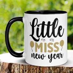 a black and white coffee mug with the words little miss, new year on it