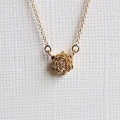 "Feminine and elegant, this necklace is for anyone who loves roses or any flowers. A delicate and beautiful rose pendant set with a sparkly diamond in the center hangs from an adjustable 16-18\" 1 mm cable chain.  It is also the perfect match to our ROSE ring available here >> https://etsy.me/35JCoHk ❁❁ I T E M ∙ D E T A I L S ❁❁ ✦Stone： Natural Diamond Shape： Round Size: 1 mm x 1 Quality: VS, F-G ✦ Pendant: Metal Type: Choice of solid 14K Gold with 20 gauge jump ring Metal Color: Rose / White / Luxury Rose Gold Necklace With Flower Charm, Round Gold Necklace, Fantasy Things, Bangles Design, Necklace Flower, Rose Pendant, Rose Necklace, Necklace Rose, Original Jewelry