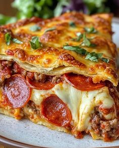 a close up of a slice of pizza on a plate with salad in the background