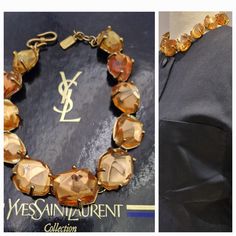 This vintage 90's resin necklace signed Yves Saint Laurent by Robert Goossens is superb.  It is made of champagne-colored resin and gold-plated metal.  Measurements: the necklace is 17,3 in long and is adjustable from 16,2 cm to 44 cm  YSLMade in France Metal Lobster Clasp with Logo Signed YSL made in France  Although it is important, it is light, its weight is 130 g  It is in excellent vintage condition, however I would like to point out that one of the resin pebbles shows signs of use (see the Logo Sign, Resin Necklace, Yves Saint Laurent, Saint Laurent, Gold Plate, Beauty Book, Accessory Gift, Electronic Accessories, Purses And Bags