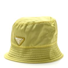 This is an authentic PRADA Re-Nylon Metal Triangle Logo Womens Bucket Hat size Small in Neon Yellow. This stylish bucket hat is in yellow nylon fabric with a Prada logo at the front. Womens Bucket Hat, Prada Logo, Triangle Logo, Nylon Fabric, Neon Yellow, Hat Sizes, Bucket Hat, Prada, Neon