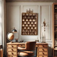 a chair and desk in front of a wall mounted chess board