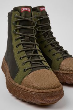 Outdoor High-top Hiking Boots With Contrast Sole, Leather High-top Sneakers With Rubber Toe Cap For Outdoor, Outdoor Sneakers With Textured Sole And Recycled Rubber, High-top Hiking Boots With Contrast Sole, Outdoor Boots With Recycled Rubber Sole, Functional Green Leather Boots, High-top Desert Boots With Rubber Sole For Outdoor, Casual Boots With Recycled Rubber Sole, Recycled Rubber Boots With Round Toe And Rubber Sole