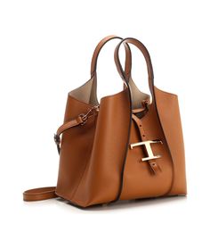 Tod's Timeless Logo Plaque Tote Bag | italist Luxury Tote Bag With Gold-tone Hardware, Luxury Tote Satchel With Rolled Handles, Luxury Calf Leather Shoulder Bag With Brass Hardware, Luxury Ralph Lauren Brown Bags, Taupe Handbags, Timeless Logo, Purse Trends, Bag Women Fashion, Timeless Wardrobe Staples