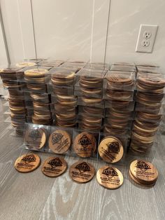 a pile of wooden coasters sitting on top of a table next to each other