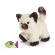 a small stuffed animal next to a toy fish