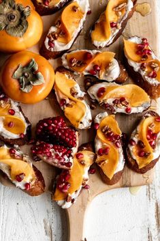 a wooden cutting board topped with lots of food