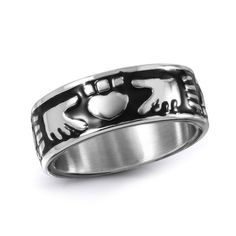 a silver ring with an elephant and heart on the inside, in front of a white background