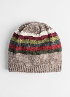 a knitted hat with multicolored stripes on the front and side, against a white background