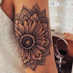 a woman with a sunflower tattoo on her arm and leg is shown in the instagram