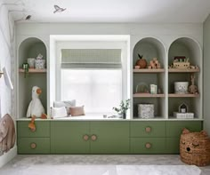 a room with shelves, stuffed animals and other items on the shelf in front of a window