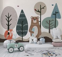 a child's playroom with toys and wallpaper