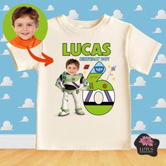 a child's t - shirt with an image of a boy in space suit