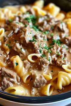 pasta with meat and sauce in a bowl