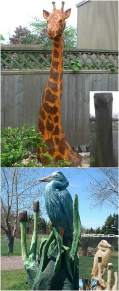 a statue of a giraffe standing next to a wooden fence in a yard