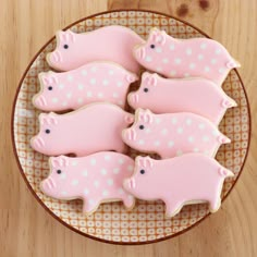 decorated cookies in the shape of pigs on a plate