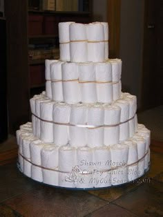 a large stack of toilet paper stacked on top of each other in the middle of a room