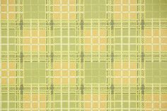 a green and yellow plaid fabric with small squares