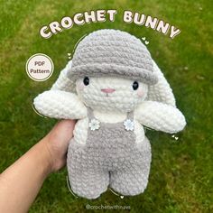 a crochet bunny is shown in the grass