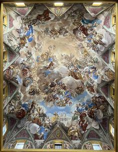 an ornate painting on the ceiling of a building