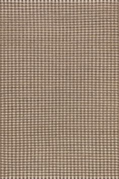 a brown and white checkered area rug