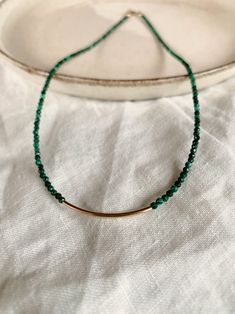 Introducing the captivating Malachite Choker Necklace - a statement piece that exudes elegance and versatility! Crafted with care in 14k Gold Filled, this stunning choker can be worn solo, adding a touch of natural allure to your neckline. Alternatively, let your creativity run wild as you mix and match it with other necklaces, achieving a mesmerizing ensemble that's uniquely you! Emerald Polished Beads Jewelry For Gifts, Dark Green Gemstone Beads Jewelry Gift, Dark Green Gemstone Beads Jewelry As Gift, Dark Green Gemstone Beads Jewelry For Gift, Gift Jewelry With Dark Green Gemstone Beads, Gift Dark Green Gemstone Beads Jewelry, Emerald Necklaces With Polished Beads Gift, Delicate Pearl Earrings, Moss Agate Bracelet