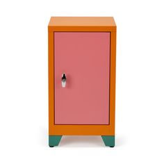 an orange, pink and green cabinet with a black knob on the door is standing against a white background