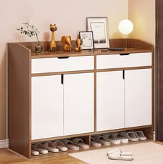 an image of a shoe rack in the living room with shoes on it's shelf