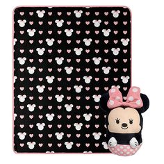 a minnie mouse blanket with a stuffed animal