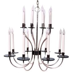 a chandelier with eight candles hanging from it's sides and four on each side