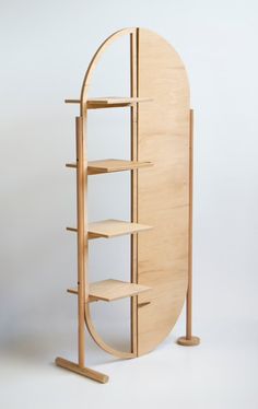 a curved wooden shelf with shelves on each side