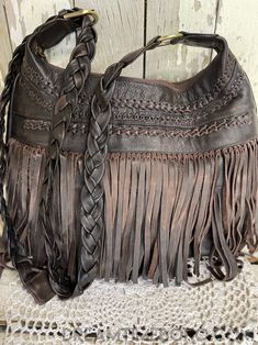 The exquisite Brooklyn fringed leather boho bag is divine, featuring double fringe, plaited detailing, and a thick, adjustable, soft leather strap! It's the ultimate addition to your boho wardrobe! Handmade Quality Genuine Leather Lined Plaited Adjustable Shoulder Strap Measurements :Approx W39cm x H33cm tassels/fringe not included in measurements Zip Close & Inside bag has a zip pocket and 2 open pockets Please keep in mind that leather is a natural product and colour variations & marks in the Artisan Shoulder Bag With Tassels For Everyday, Boho Purse, Bohemian Leather Hobo Bag In Crossbody Style, Bohemian Hobo Bag With Leather Handles, Bohemian Leather Crossbody Hobo Bag, Bohemian Hobo Bag With Fringe For Travel, Bohemian Fringe Hobo Bag For Travel, Leather Hobo Bag With Adjustable Strap For Festivals, Bohemian Hobo Bag In Soft Leather