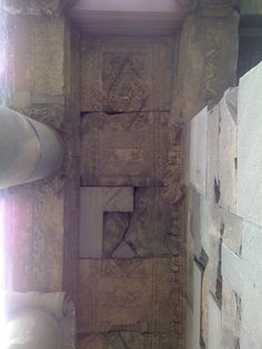 the inside of a building with stone carvings on it