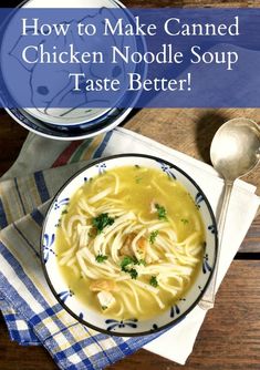 a bowl of chicken noodle soup on top of a wooden table