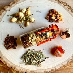 an assortment of spices on a white plate