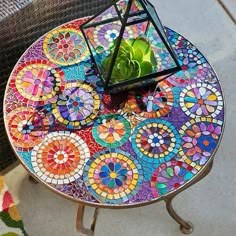 a table with a colorful mosaic design on it