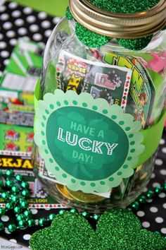 a mason jar filled with lucky charms and green glitters on top of a table