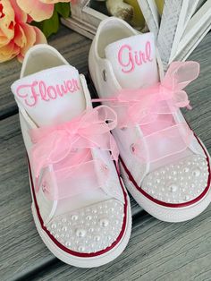 PEARLS ON THE TOE and BACK and ribbon laces. (Tie dye May be available. Message me ) Are you looking for a great  idea for the kids in your wedding? Look no further, I will personalize their shoes!! They can say flower girl, ring bearer or their name, its all up to you. What a cute way to dress up a pair of Chucks. You can put a small monogram, a short name or even a cute little design. The possibilities are endless.  These shoes come with pearls in the toes and ribbon laces. I can do sheer or s Ring Bearer Shoes, Flower Girl Ring Bearer, Girl Ring Bearer, Wedding Sneakers, Flower Girl Shoes, June Wedding, Dream Wedding Ideas Dresses, Future Wedding Plans, Cute Wedding Ideas