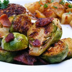 brussel sprouts, bacon and potatoes on a white plate