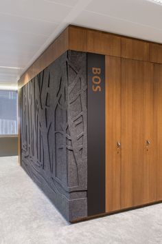 an office cubicle with wood paneling and doors