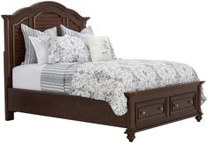 a bed with drawers underneath the headboard and foot board on both sides is shown