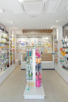 the inside of a pharmacy store with shelves full of products