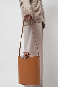 Vegetable-tanned cowhide leather bucket bag with cross body strap. Structured flat bottom. A perfect everyday bag that will wear beautifully over time. Black Crane, Leather Bucket Bag, Leather Bucket, Everyday Bag, Cowhide Leather, Cross Body, Bucket Bag, Leather, How To Wear