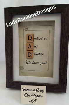 a father's day box frame with a sign