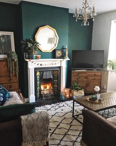 a living room filled with furniture and a fire place in front of a flat screen tv