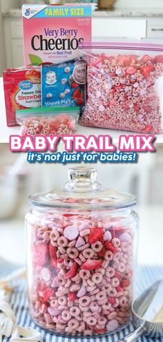 baby trail mix in a glass jar with pink and red sprinkles on top