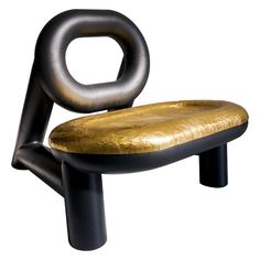 a black and gold colored chair on white background