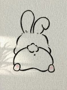 a drawing of a bunny with a heart on it's chest and eyes closed