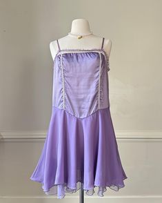 - Vintage violet purple slip dress featuring unique suede-like bust with pleated fairy layered skirt - square neckline; ruffled trimmings; adjustable straps - size M - great condition with no flaws  🤍 Size of mannequin: size 2 - 4 Purple Ruffled Dress With Spaghetti Straps, Purple Underbust Corset Dress, Cute Purple Playwear Dress, Purple Slip Dress, Coquette Purple Sleeveless Sleepwear, Purple Fairycore Dress With Ruffles, Vintage V-neck Bedtime Dress, Purple Ruched V-neck Dress, Vintage Slip Dress